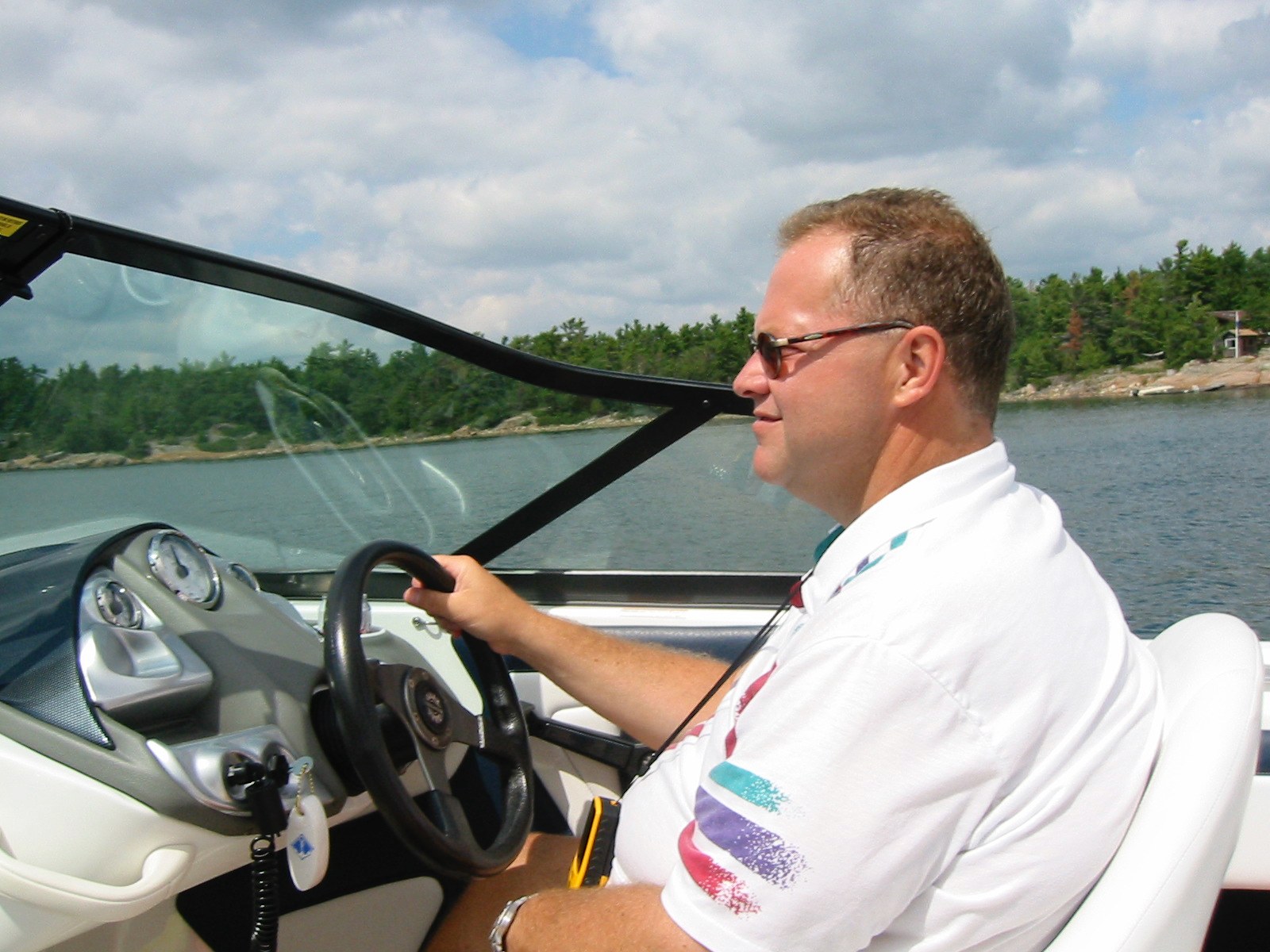 Dave Welling at the wheel of his boat in the North Channel near Dillon, Carling